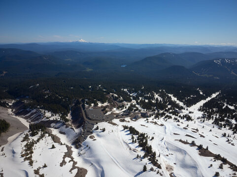 A snowy mountain range with a clear blue sky