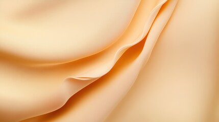 Peachy Perfection: A soft, delicate peach fabric drapes gracefully, showcasing its luxurious texture and subtle sheen. The gentle curves and folds create an abstract, elegant design. 