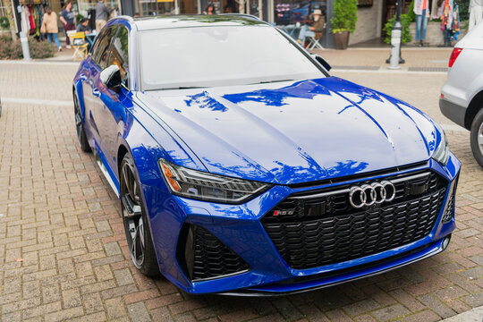 Seattle, USA - July 22, 2024: 2022 Audi RS7 blue sportscar car parked outdoor, corner view. Audi RS7 sportscar in the street. Luxury sport car of Audi RS7. Audi dealership