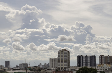 Amazing Clouds and Sky over Metropolitan City. Bangkok city skyscrapers at Afternoon with Dramatic sky background. use it as your wallpaper, poster and banner design, Selective focus.