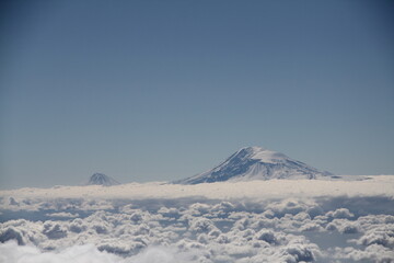 Aerial view of the snow-capped Mount Kilimanjaro above the clouds in Tanzania, Africa