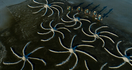 Salt making from sea water in Vietnam is completely handmade. Photo taken in Khanh Hoa on August...