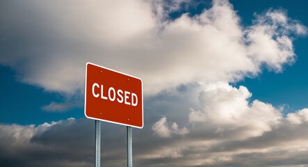 closed text on road sign with clouds and sky background