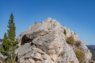 Silver Gate, that formed when travertine from Terrace Mountain collapsed in a landslide. calcium-carbonate rocks. Yellowstone National Park, Wyoming