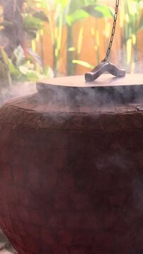 A stone brick tandoor oven in a luxurious restaurant for roasting meat and fish in the tandoori style.