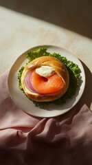 Delicious Smoked Salmon Bagel Sandwich with Cream Cheese and Onion on a White Plate