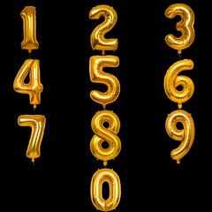 A transparent Set of golden inflatable balloons shape of numbers