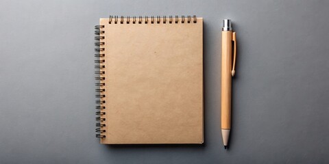 School notebook and craft cardboard pen on a gray background, school, notebook, paper, gray, background, spiral, notepad