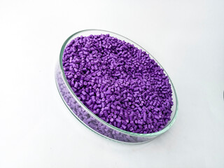 cold cutting type masterbatch granules in pantri cup, pigment coloring resin raw material plastic, isolated on white background for product catalog design profile of industrial plastic company