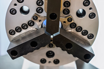  Part clamping systems in CNC machines. Large lathe chuck. Lathe with large chuck. Vice for clamping parts. Holder for clamping round parts..