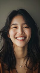 Smiling young woman with long dark hair