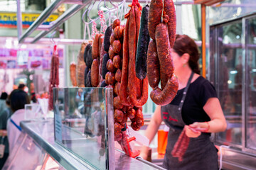 Charcuterie stand at a local food market in Valencia