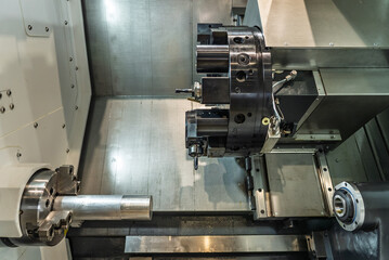Inside view of a cnc machine. CNC lathe interior.Cnc machine. The CNC lathe machine or Turning machine. Turning numerical control machine with tools and chuck.