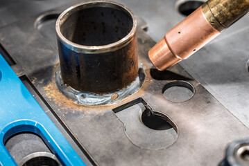 Robot welding steel. Industrial welding robot and working with metal parts. Robot welds steel....