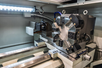 Inside view of a cnc machine. CNC lathe interior.Cnc machine. The CNC lathe machine or Turning machine. Turning numerical control machine with tools and chuck.