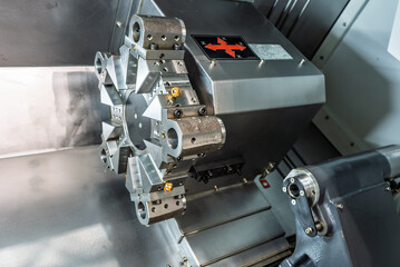 Inside view of a cnc machine. CNC lathe interior.Cnc machine. The CNC lathe machine or Turning machine. Turning numerical control machine with tools and chuck.