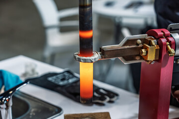 Surface hardening of steel. Induction hardening type of surface hardening . Metal part is...