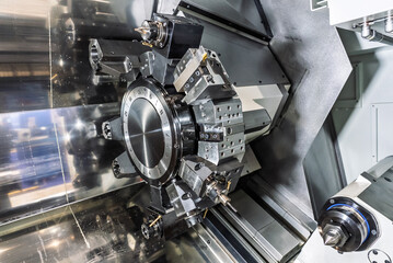 Inside view of a cnc machine. CNC lathe interior.Cnc machine. The CNC lathe machine or Turning machine. Turning numerical control machine with tools and chuck.