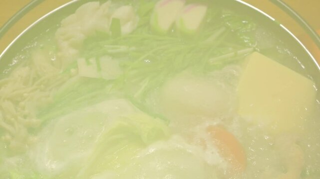 Mizore Nabe, a traditional Japanese home-style nabe dish consisting of grated radish, carrots and other vegetables, chicken, mushrooms, and seafood.