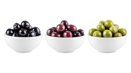 A vibrant display of black, purple, and green olives in white bowls against a transparent background during a bright kitchen setting.