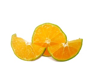 half lemon and slice isolated on white background. orange peel is green.