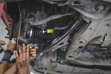 Car CV Axle replacement on a front wheel drive car.