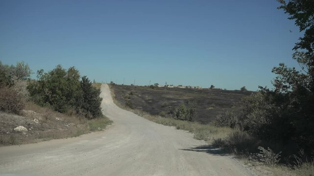 Kurna rural road leading to village. Country road concept.
