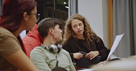 Students gather during geometry class to study together, collaborating and discussing the lesson, enhancing their understanding through teamwork and peer learning.