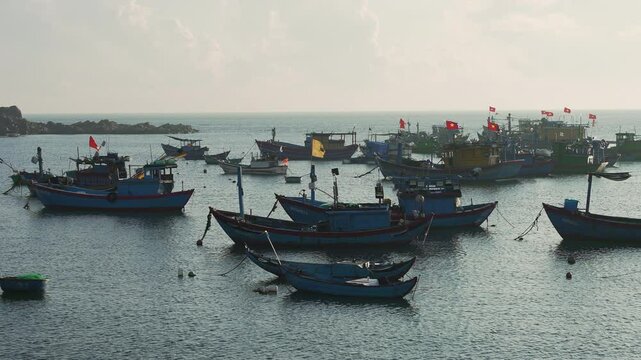Quy Nhon, Vietnam-Pan shot-Fishing Boats on Calm Sea at Sunrise