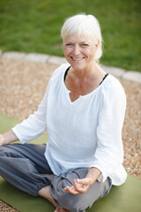 Obraz premium Portrait, lotus pose and senior woman in nature for relax, calm and breathing in morning. Health, meditation and elderly female person in padmasana for outdoor flexibility, balance and mindfulness.