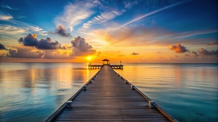 Obraz premium Sunrise on a Caribbean beach with a pier in the background