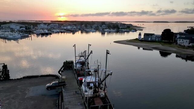 aerial push over fishing boats in hyannis port massachusetts