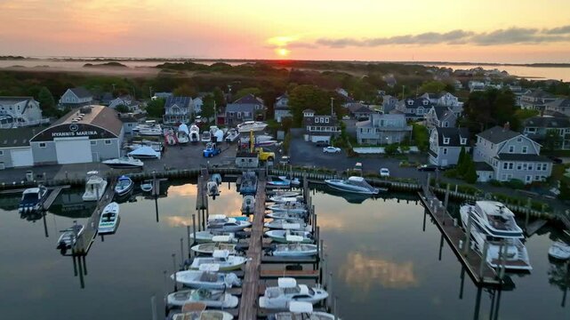 aerial fast push over boats at sunrise in Hyannis Port Massachusetts