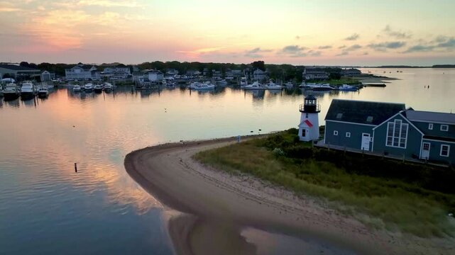 aerial at sunrise pushing in over the harbor at hyannisport, hyannis port massachusetts