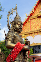 Fototapeta premium Photo of black and gold-plated Thao Wessuwan. Background image.