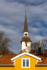 Fototapeta premium Mariefred, Sweden A view of the Mariefred Church and old traditional wooden buildings.