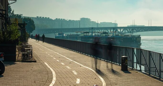Budapest, Hungary - October 10, 2024: Budapest&rsquo;s Pathways Along the Danube Near Balna, foggy morning. Timelapse, zoom out transition.