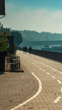 Budapest, Hungary - October 10, 2024: Budapest&rsquo;s Pathways Along the Danube Near Balna, foggy morning. Timelapse, zoom out transition, vertical orientation.