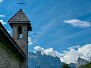 Picturesque stone church of St. George nestled in idyllic village Theth, Northern Albania....