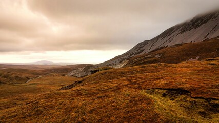 Glenveagh National Park in Donegal Ireland aerial view - The breathtaking landscape features rolling hills that gracefully descend into lush green valleys © 4kclips