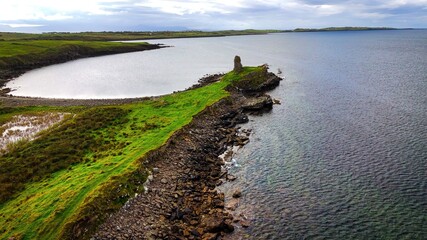 Obraz premium St John s Point in Donegal at the west coast of Ireland - a breathtaking coastal view showcasing a historic ruin that stands proud by the sea