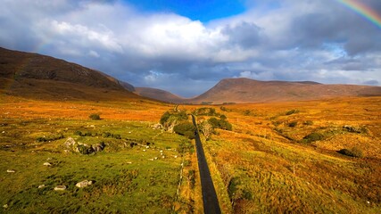 Glenveagh National Park in Donegal Ireland aerial view - The breathtaking landscape features rolling hills that gracefully descend into lush green valleys