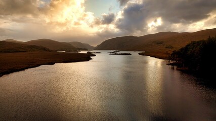 Glenveagh National Park in Donegal Ireland aerial view - The breathtaking landscape features rolling hills that gracefully descend into lush green valleys