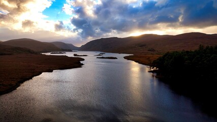 Glenveagh National Park in Donegal Ireland aerial view - The breathtaking landscape features rolling hills that gracefully descend into lush green valleys