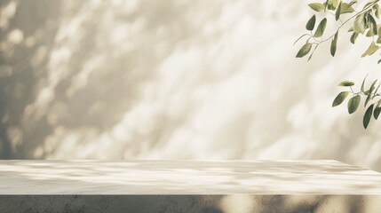 Fototapeta premium Empty tabletop bathed in soft light with leaf shadows on a beige background, creating a serene space for showcasing products in a modern, elegant setting