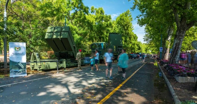 Budapest, Hungary - August 20, 2024: Armored Vehicles Parade Down K&oacute;s K&aacute;roly Street in Budapest. Timelapse, slide transition.