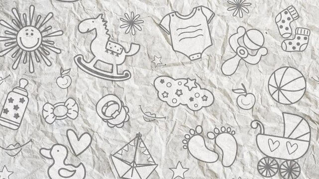 Videophone on crumpled paper with children's toys. Horse, pacifier, cloud, footprints, boat