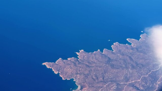 View of Greece from airplane window during daytime.