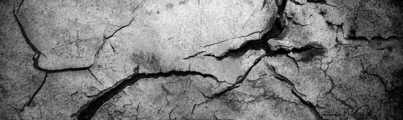 Surface of white concrete wall with cracks and holes. Abstract pattern of concrete wall