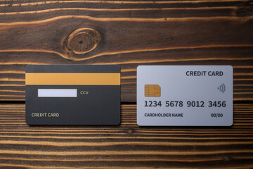 Top view of debit or credit card on wooden background